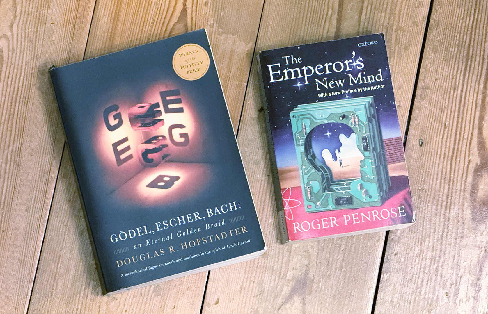 Two books on a wooden floor